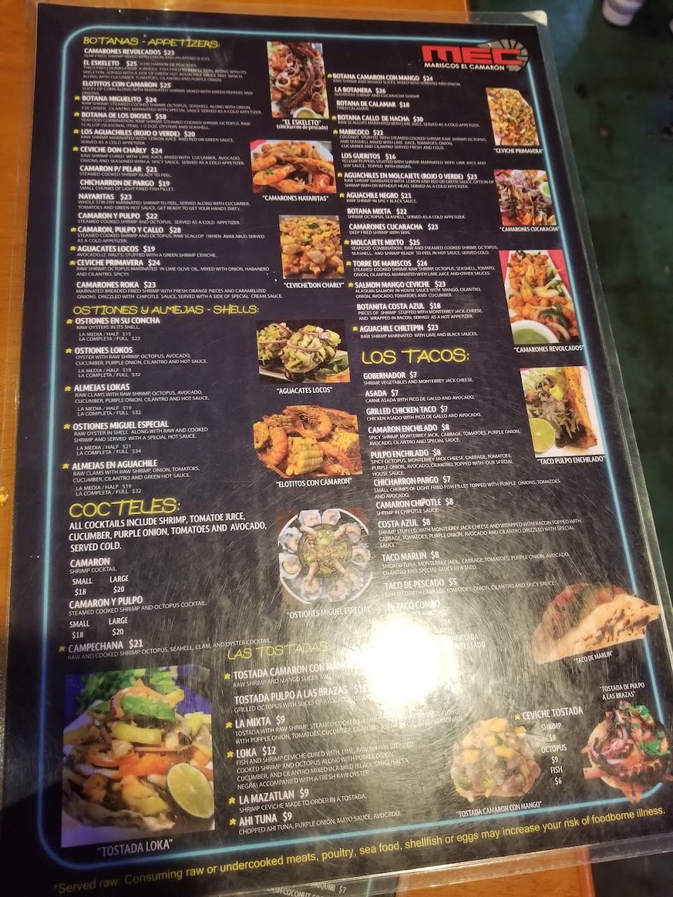 Seafood dishes with rice and garnish.
